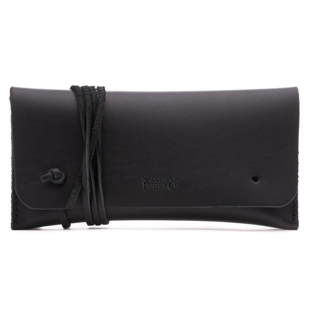 Cash & Receipt Bag in Black, closed flap with wrapped leather tie and embossed logo, front view