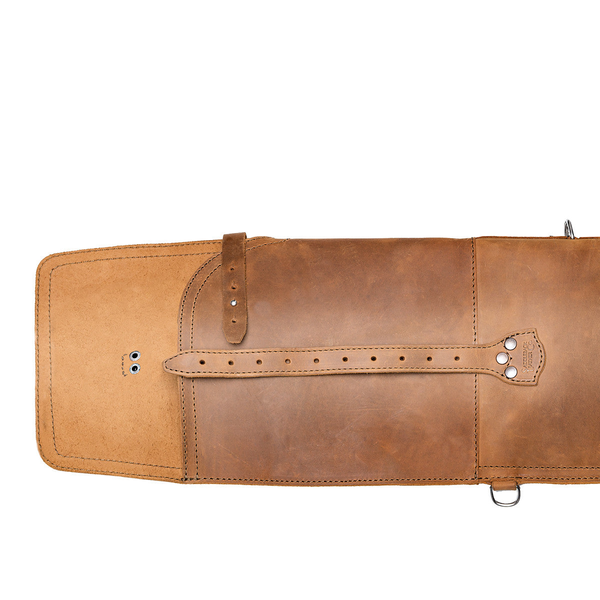Shotgun Sleeve in Tobacco, close-up of the end flap with its long leather closure strap