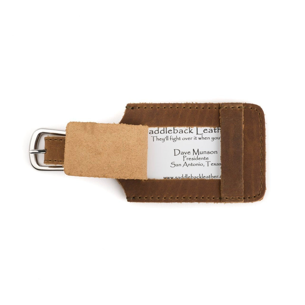 Leather Luggage Tag in Tobacco with a business card in the window and buckled strap, front view