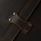 Leather Trunk in Dark Coffee Brown, close-up of riveted strap keeper over a stitched strap
