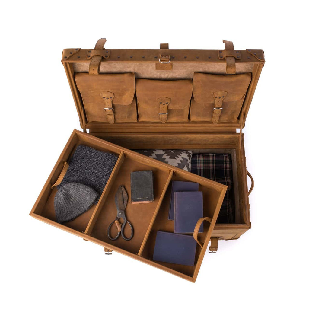 Leather Trunk in Tobacco, open with tray lifted out holding a knit hat, scissors and notebooks