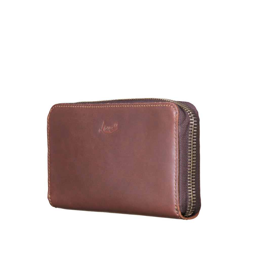 Continental Leather Wallet in Chestnut, angled front view showing zipper edge
