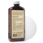 Chamberlain's Liniment No. 1 leather conditioner, angled back label view with an applicator pad behind