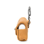 Leather AirPods Pro Case in Tobacco, side view with flap closed over the charging case and carabiner clip