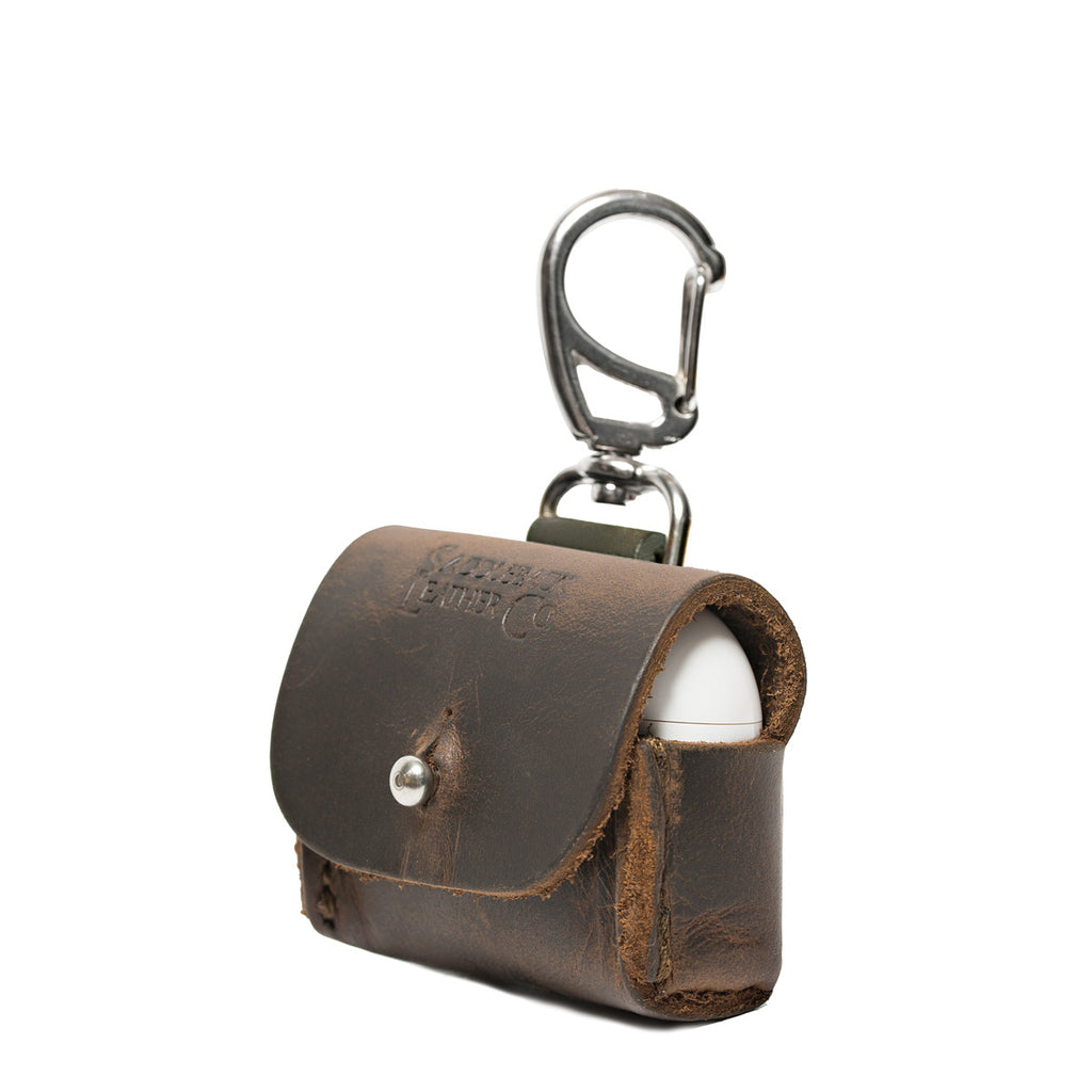 Leather AirPods Pro Case in Dark Coffee Brown, angled front view with embossed logo, stud closure and carabiner clip