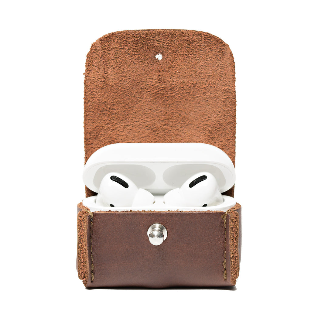 Leather AirPods Pro Case in Chestnut, open with the charging case lid up showing the earbuds inside