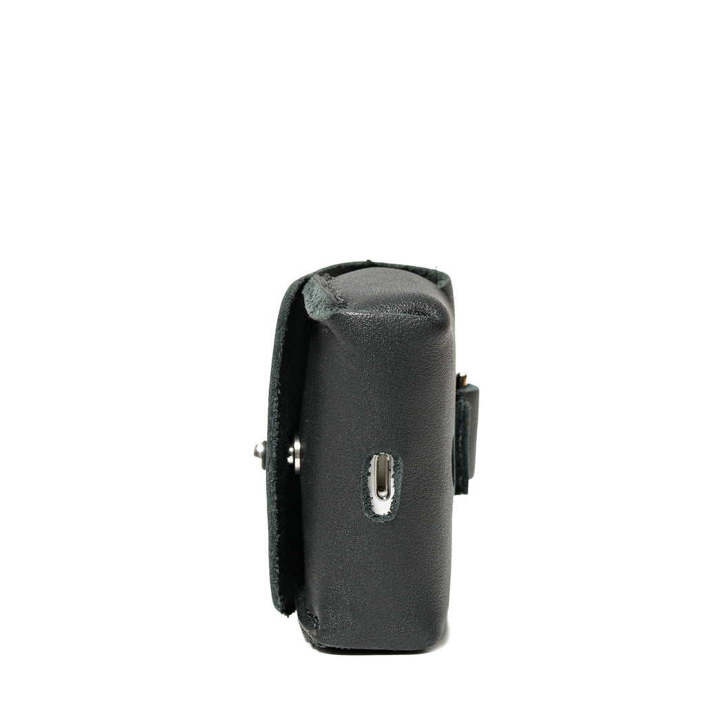 Leather AirPods Pro Case in Black, side view showing the stitched gusset and stud closure