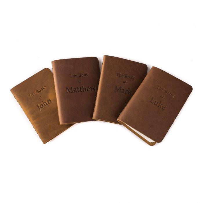 Leather Pocket Bibles Four Gospels in tan, John, Matthew, Mark and Luke books fanned out
