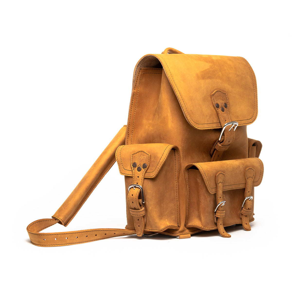 Front Pocket Leather Backpack in Tobacco, angled view with buckled flap, front pockets and strap