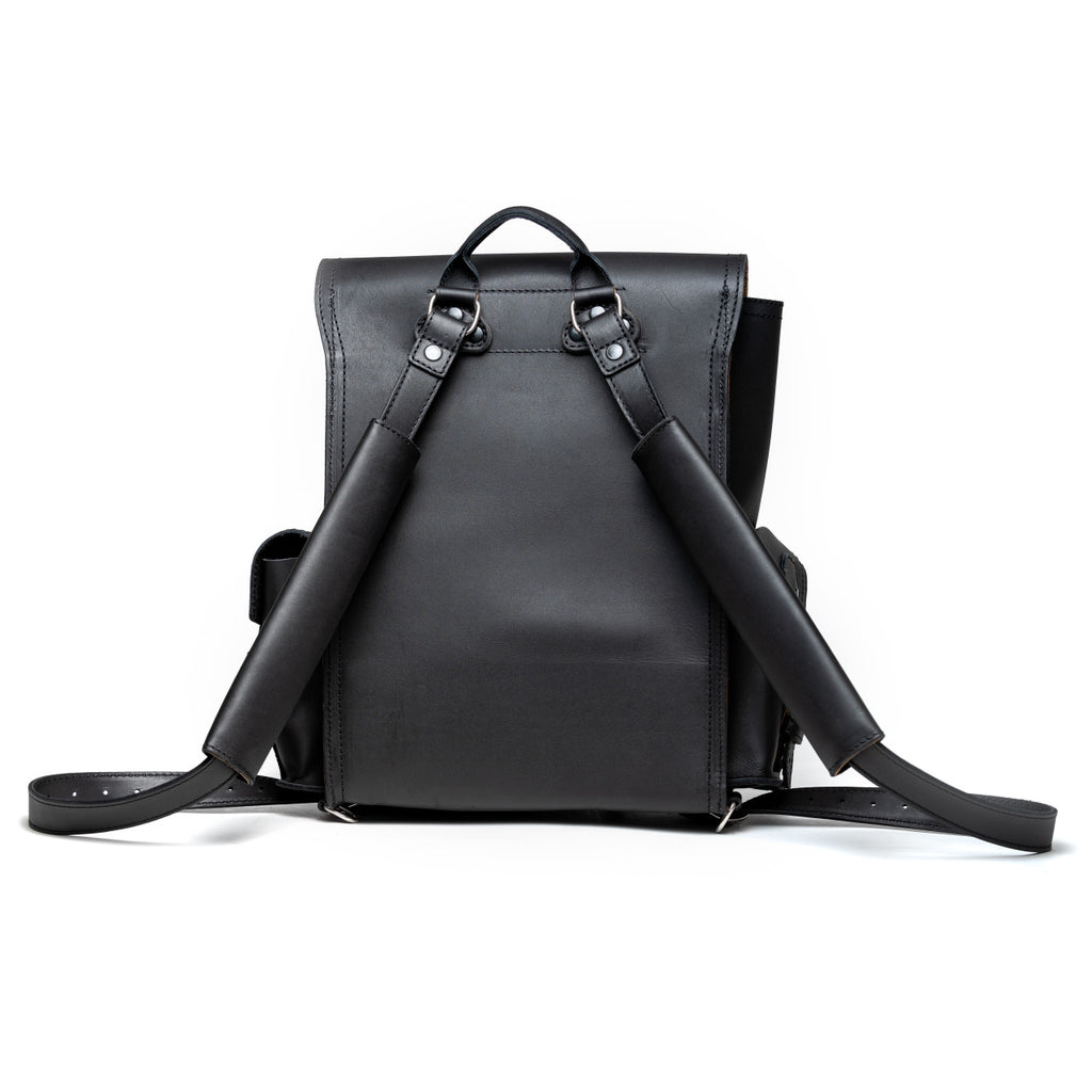 Front Pocket Leather Backpack in Black, back view with padded shoulder straps and top handle