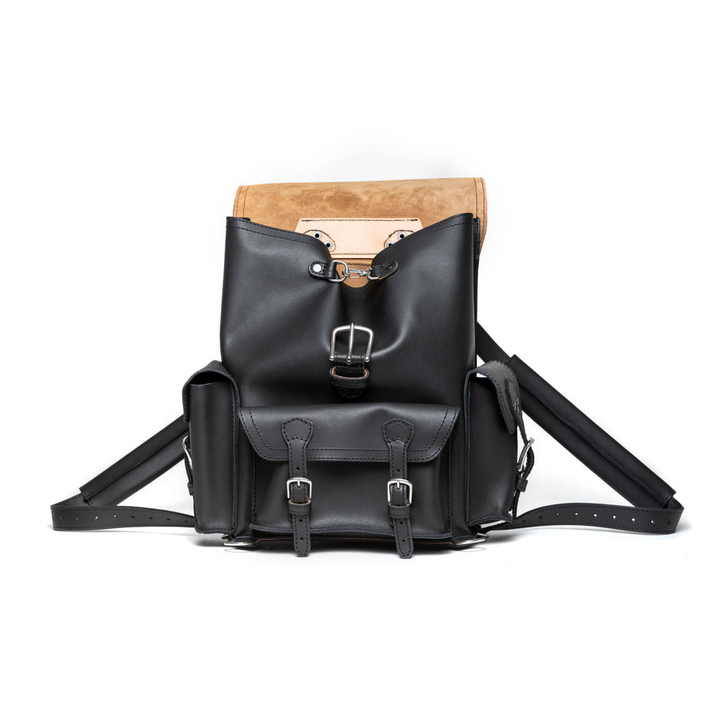 Front Pocket Leather Backpack in Black, front view with flap folded back showing the suede underside
