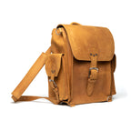 Tank Backpack in Tobacco, angled view with buckled flap, side pocket and shoulder strap