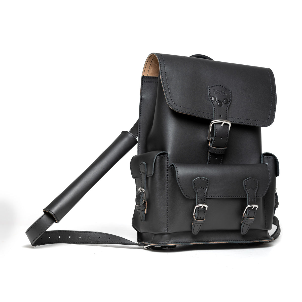 Thin Front Pocket Leather Backpack in Black, angled view with buckled flap, front pocket and strap