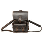 Thin Front Pocket Leather Backpack in Dark Coffee Brown, front view with buckled flap and front pocket