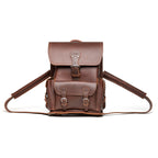 Thin Front Pocket Leather Backpack in Chestnut, front view with buckled flap and front pocket