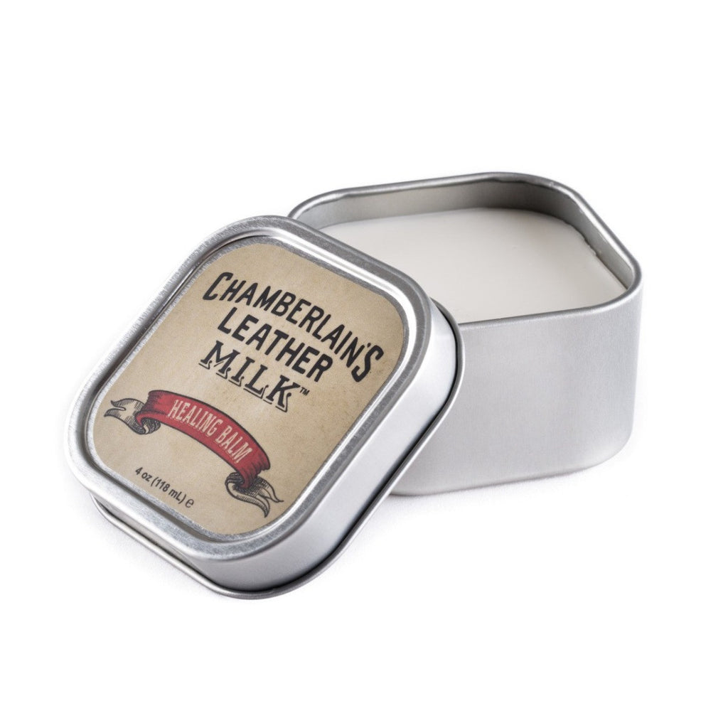 Chamberlain's Healing Balm leather restorer in an open square tin with the labeled lid propped against it