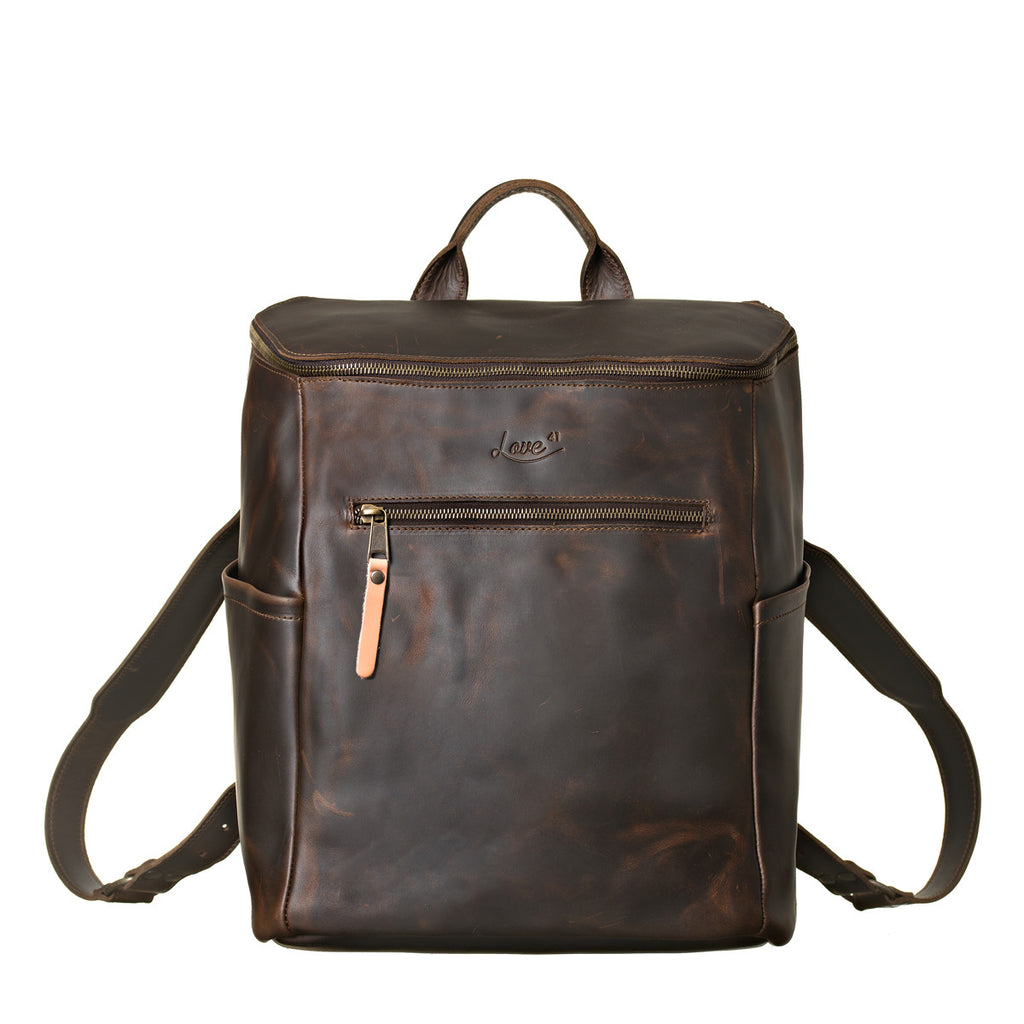 All in One Leather Backpack in Dark Coffee Brown, front view showing zippered pocket, side pockets and straps