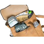 All in One Leather Backpack in Tobacco packed as a diaper bag with diapers, bottles and baby supplies