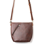 Crossbody Concealed Leather Bag in Chestnut, front view with diagonal zipper pocket and strap