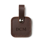 Leather Bag Tag in Chestnut with snap strap, personalized with an engraved DCM monogram