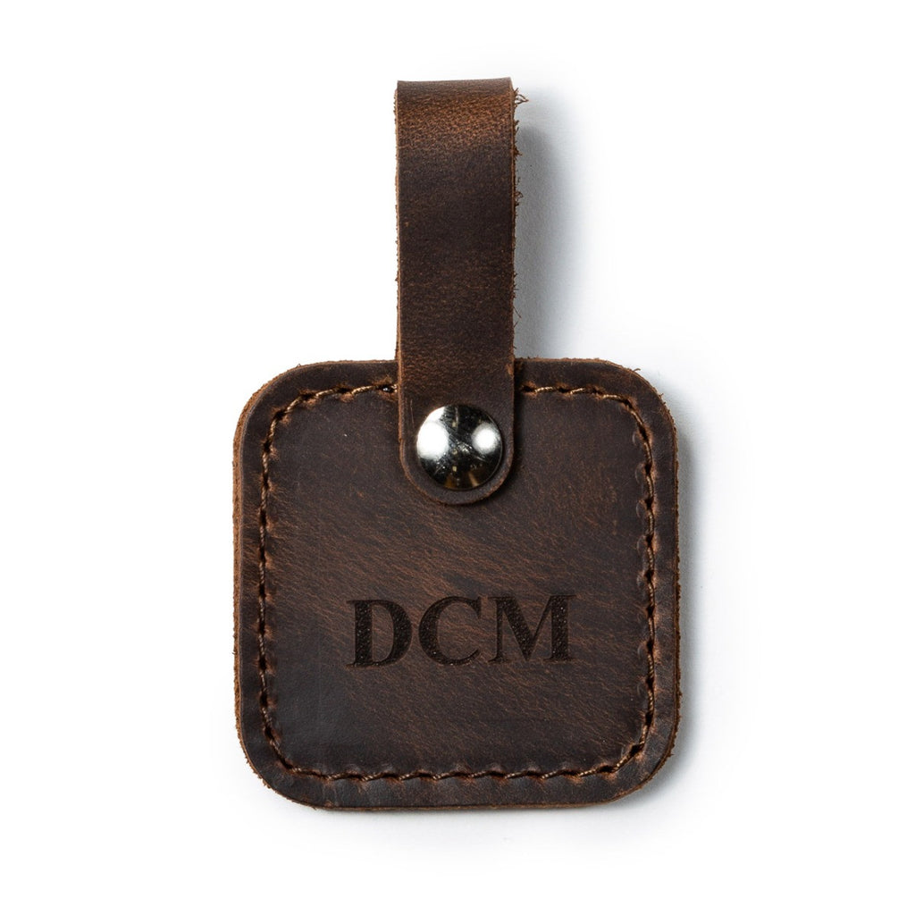 Leather Bag Tag in Dark Coffee Brown with snap strap, personalized with an engraved DCM monogram