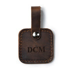 Leather Bag Tag in Dark Coffee Brown with snap strap, personalized with an engraved DCM monogram