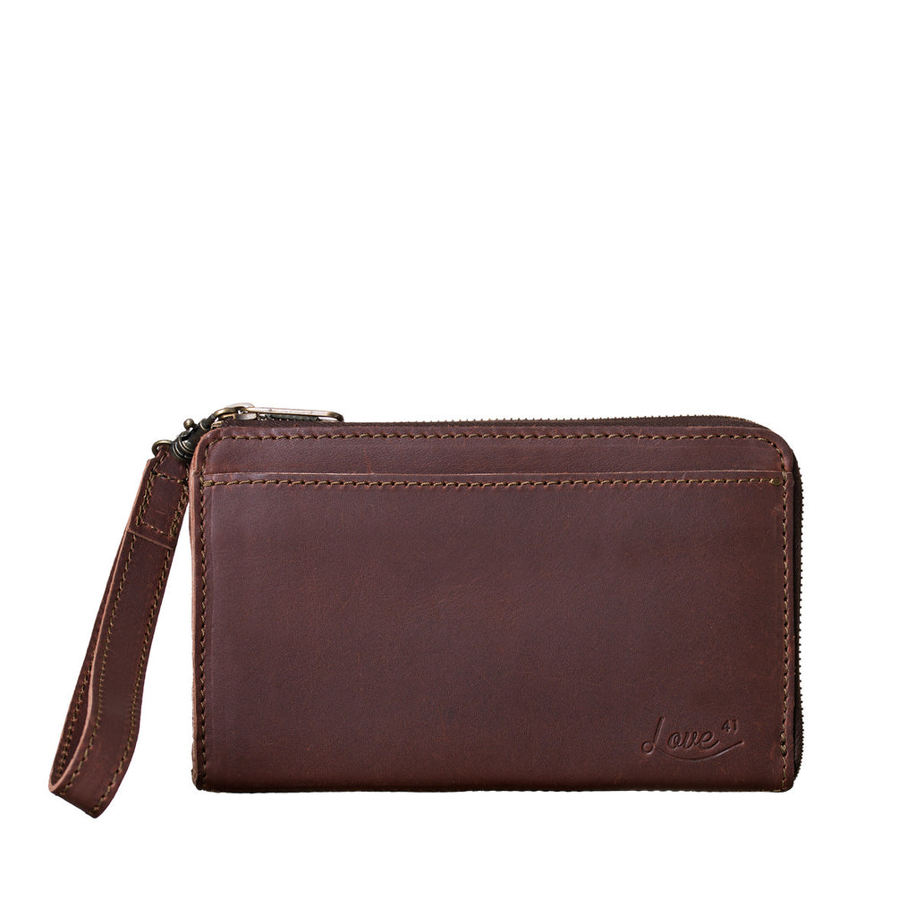 Medium Wristlet Leather Wallet in burgundy brown, front slip pocket with embossed logo and wrist strap
