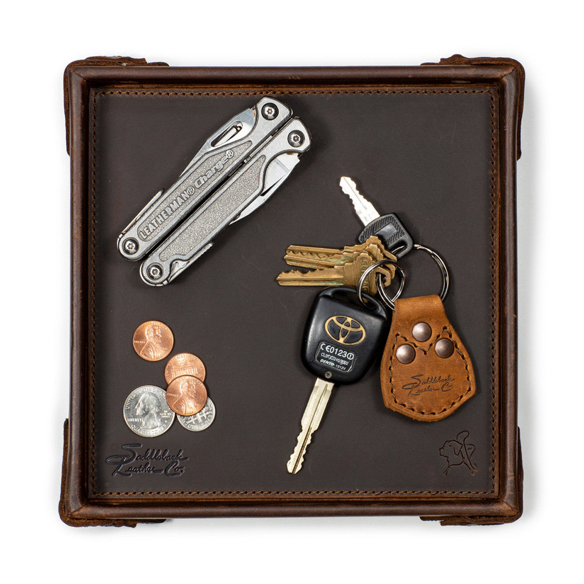The Leather Grandfather Valet Tray in Dark Coffee Brown, top-down view holding a multi-tool, keys, key fob and coins