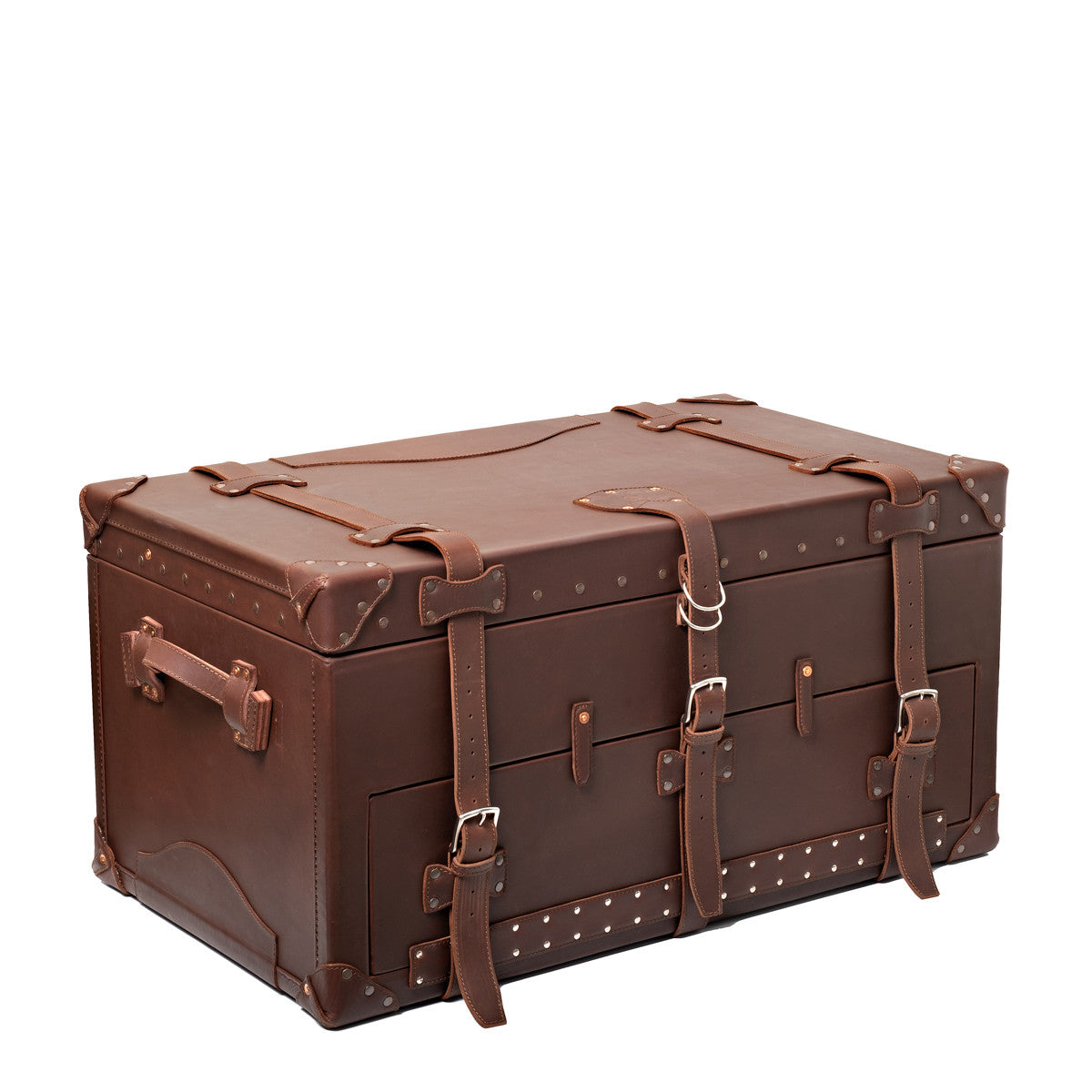 Leather Trunk in Chestnut, closed angled view with buckled straps, side handle and studded trim