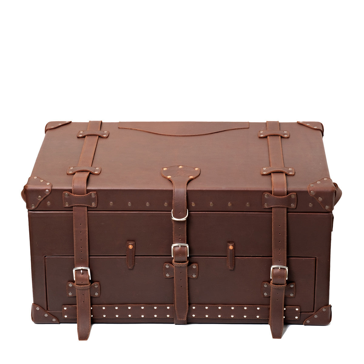 Leather Trunk in Chestnut, closed front view with three buckled straps, studded trim and corner guards