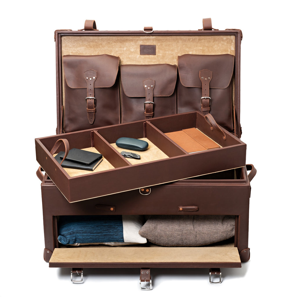 Leather Trunk in Chestnut with removable tray lifted out holding a wallet, sunglass case and pocketknife