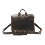 Flight Bag Leather Briefcase in dark brown, back view with slip pocket and padded shoulder strap