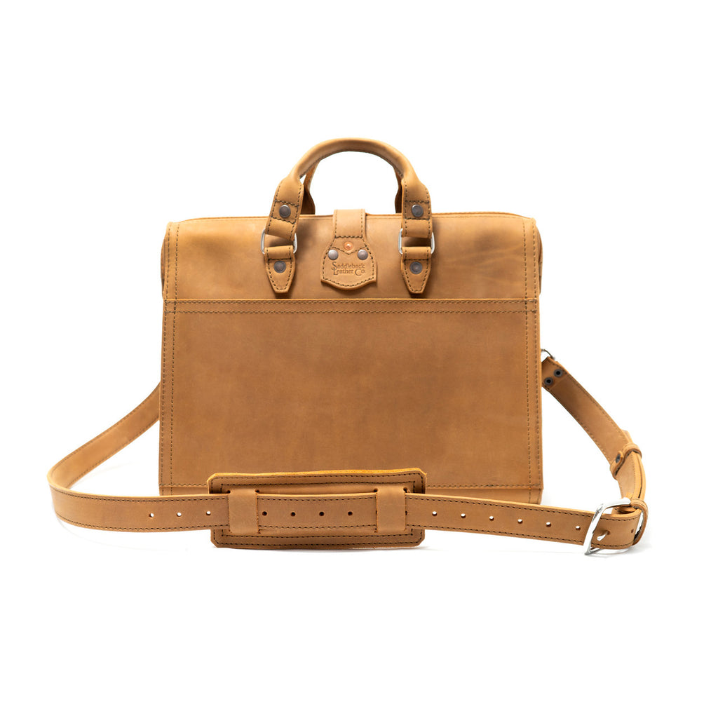 Flight Bag Leather Briefcase in tan, back view with slip pocket and padded shoulder strap