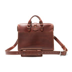 Flight Bag Leather Briefcase in chestnut, back view with slip pocket and padded shoulder strap