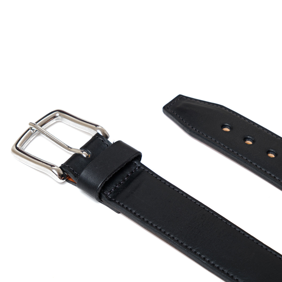 Italian Casual Belt in Pitch Black laid flat, close up of the silver buckle and belt tip