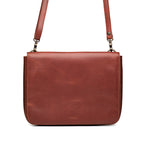 Magnetic Fold Over Bag Large in Chestnut, front view with fold-over flap, embossed logo and shoulder strap