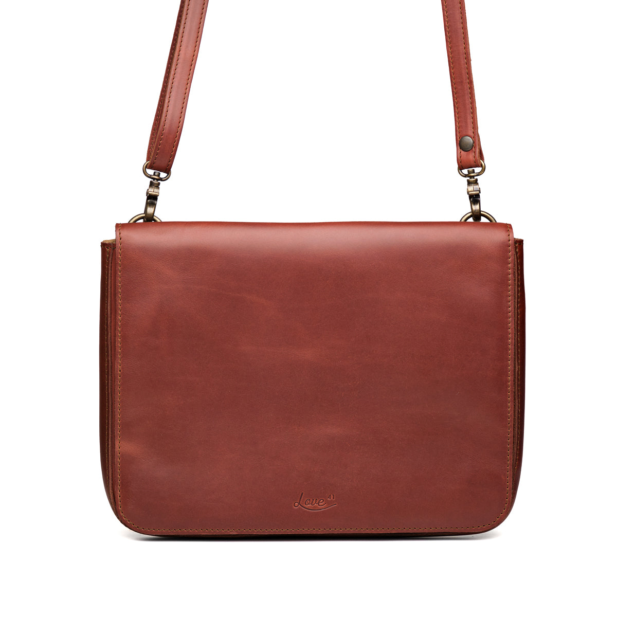 Magnetic Fold Over Bag Large in Chestnut, front view with fold-over flap, embossed logo and shoulder strap