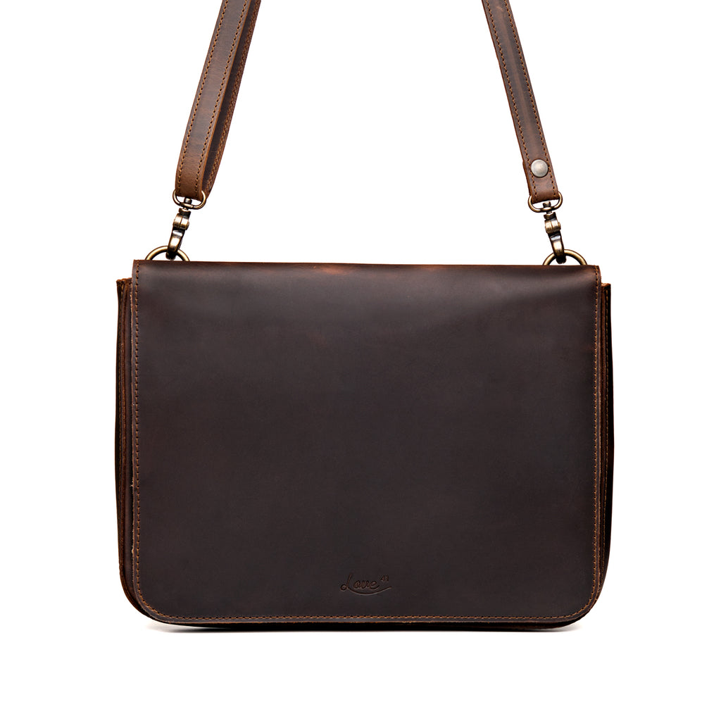 Magnetic Fold Over Bag Large in Dark Coffee Brown, front view with fold-over flap, embossed logo and shoulder strap