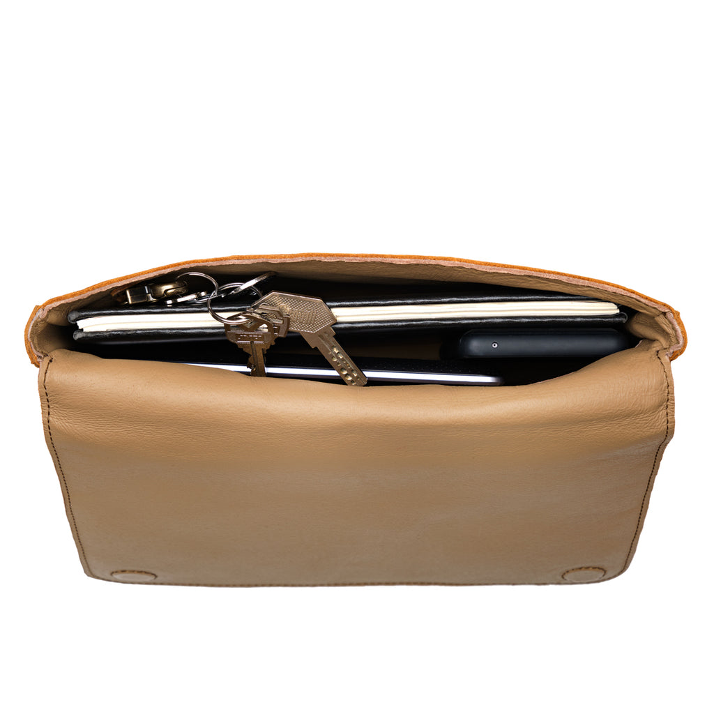 Magnetic Fold Over Bag Large in Tobacco, close-up of the open top with suede lining holding a laptop and keys