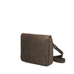 Magnetic Fold Over Bag Medium in Black, angled side view with strap resting beside the bag