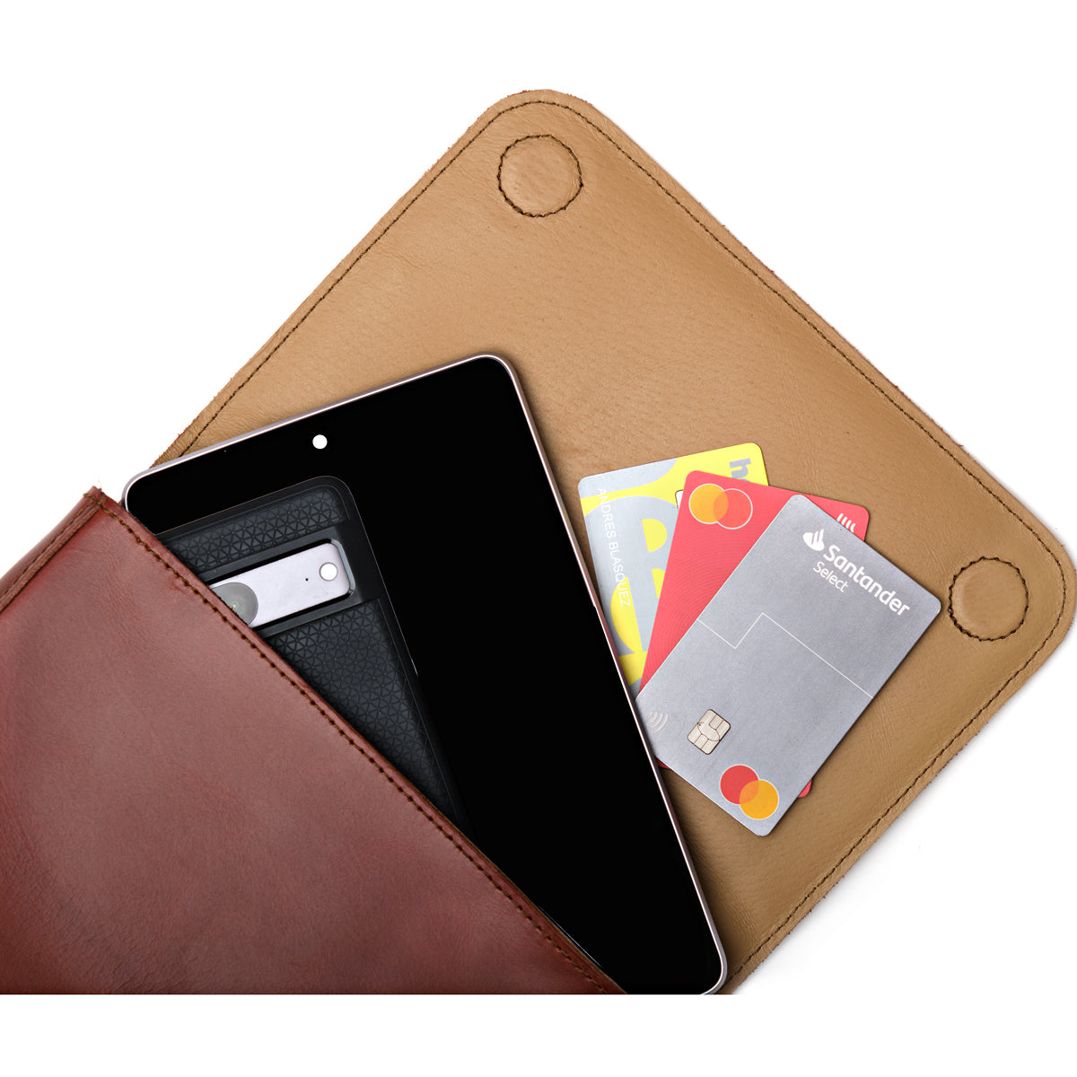 Magnetic Fold Over Bag Medium in Chestnut, close-up of magnetic flap opened over a phone and cards