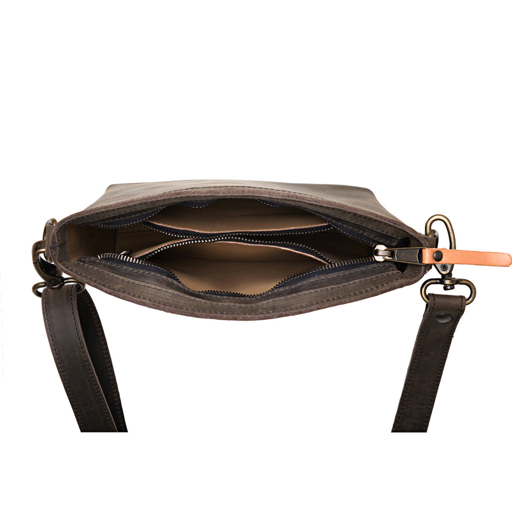 Lanita Small Crossbody in charcoal gray, top-down view of unzipped interior with slip pockets