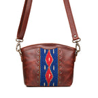 Lanita Small Crossbody in Chestnut, front view with blue and red woven panel, studs and shoulder strap