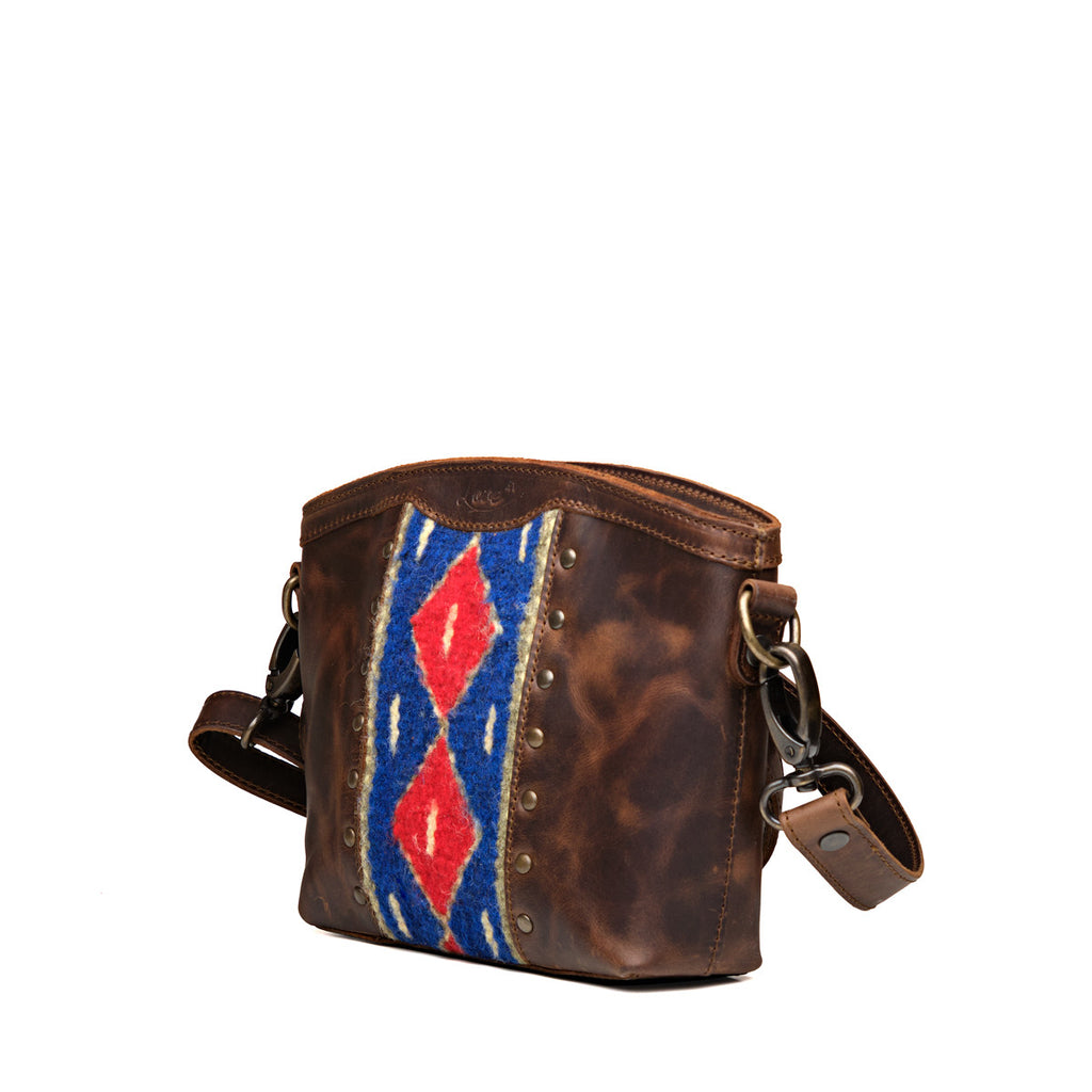 Lanita Small Crossbody in Dark Coffee Brown, angled front view with woven panel and strap clip