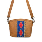 Lanita Small Crossbody in Tobacco, front view with blue and red woven panel, studs and shoulder strap
