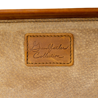 Grandfather Carry On in Chestnut, close-up of the Grandfather Collection leather badge on the canvas lining