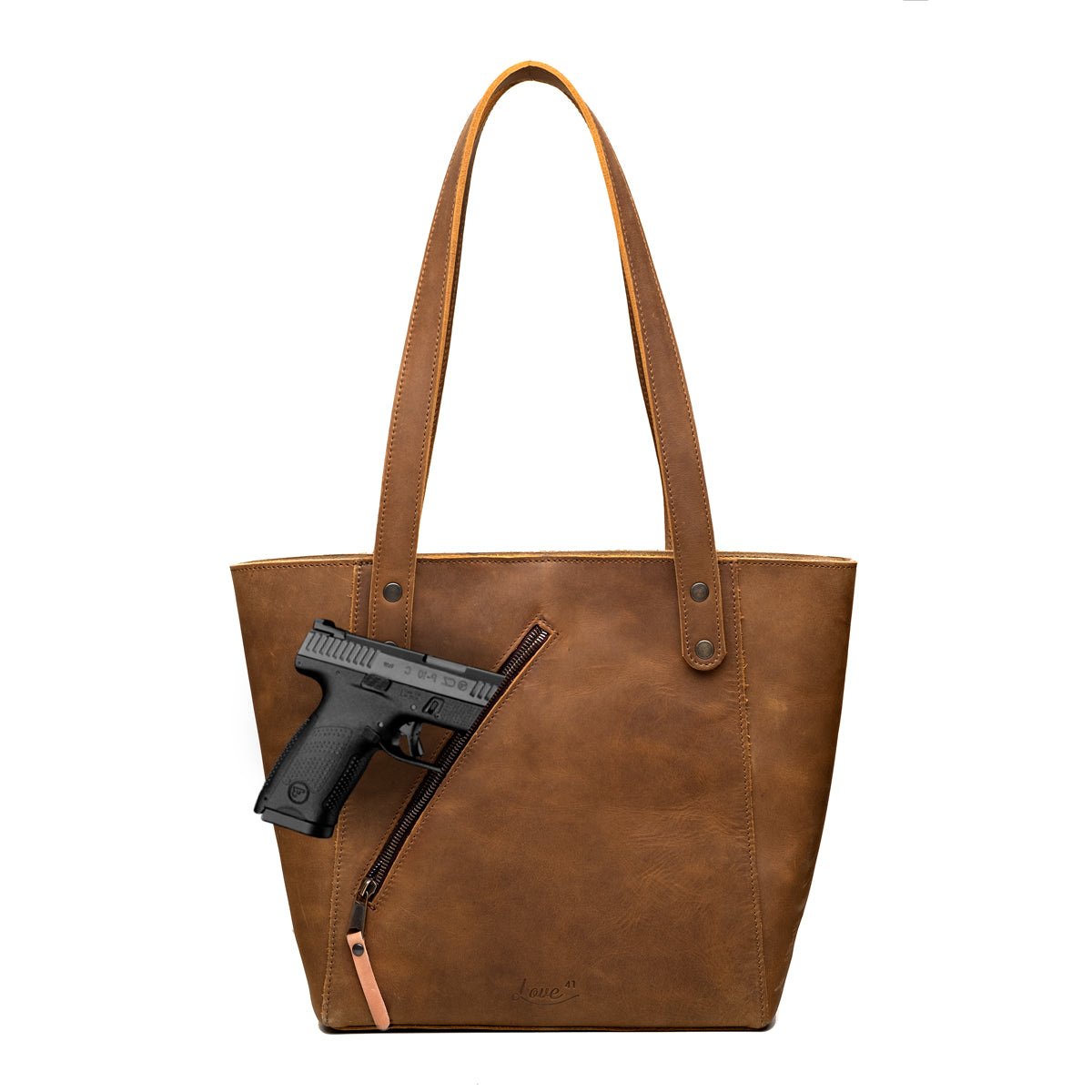 Concealed Carry Leather Tote in Tobacco, front view with a pistol emerging from the diagonal concealed carry pocket