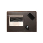 Desk Pad in Dark Coffee Brown styled as a workspace with a laptop, phone and mouse, overhead view