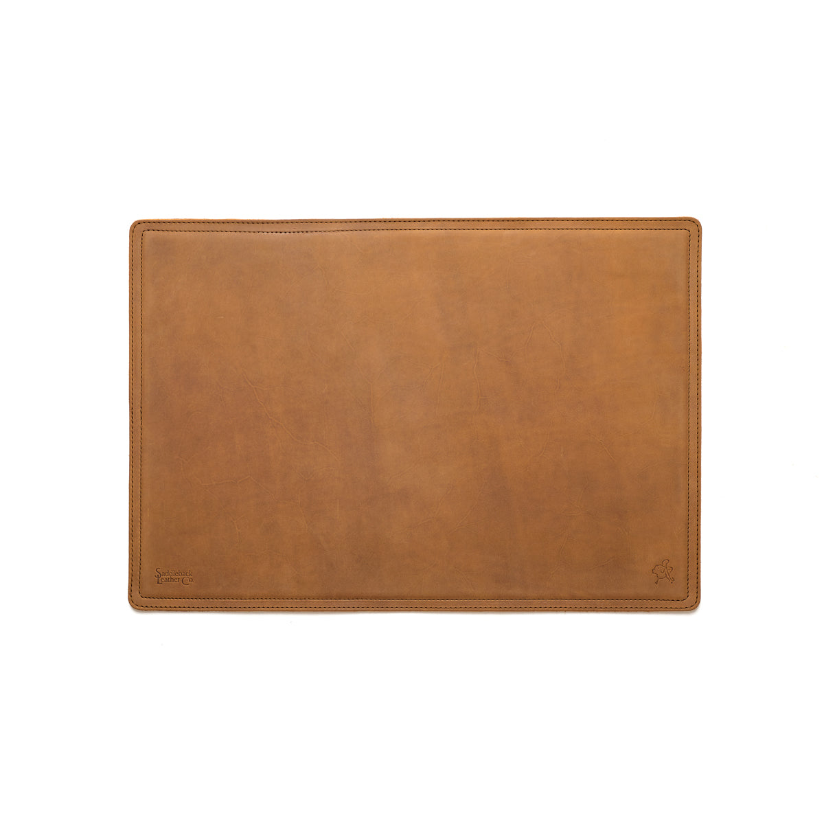Desk Pad in Tobacco leather, empty top-down view showing stitched border and rounded corners