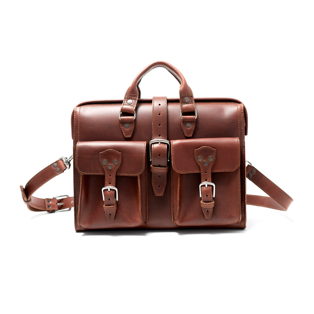 Flight Bag Leather Briefcase in chestnut, front view with two buckled pockets and detachable shoulder strap